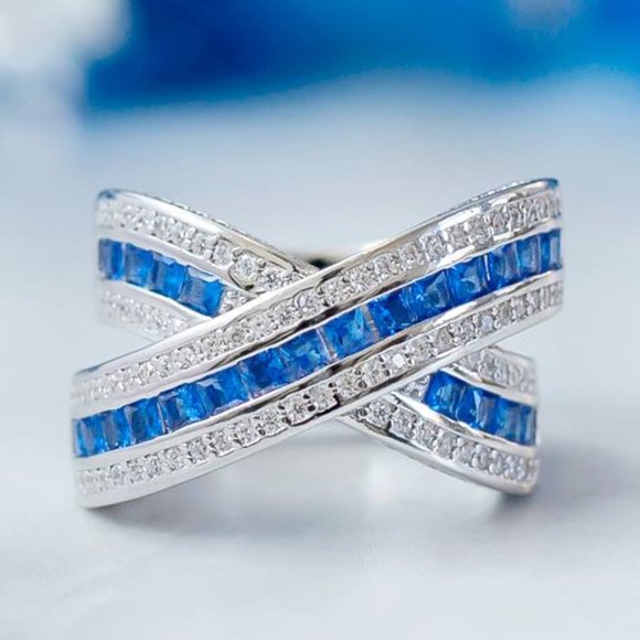 Elegant Silver and Blue Crossover Ring - Picture 1 of 8